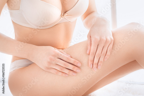 Young woman body care at home indoors