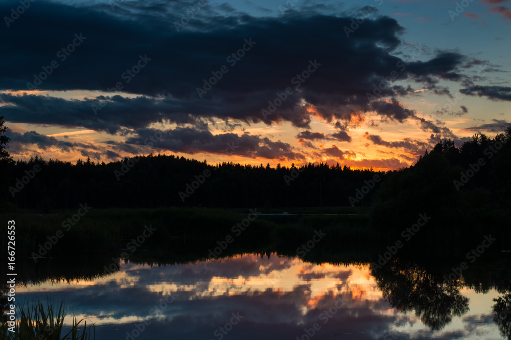 Sunset photo in clouds and reflections.