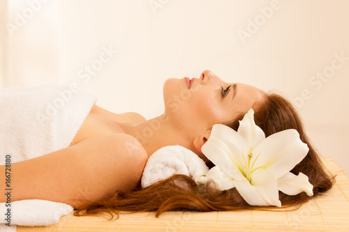 attractive young, beautiful and healthy woman in spa salon. Traditional oriental aroma therapy and beauty treatments.
