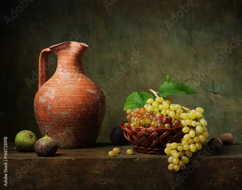 Still life with white wine and grapes
