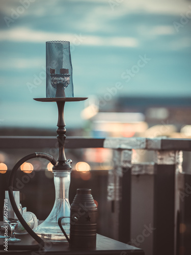 Hookah on the table with a street view photo