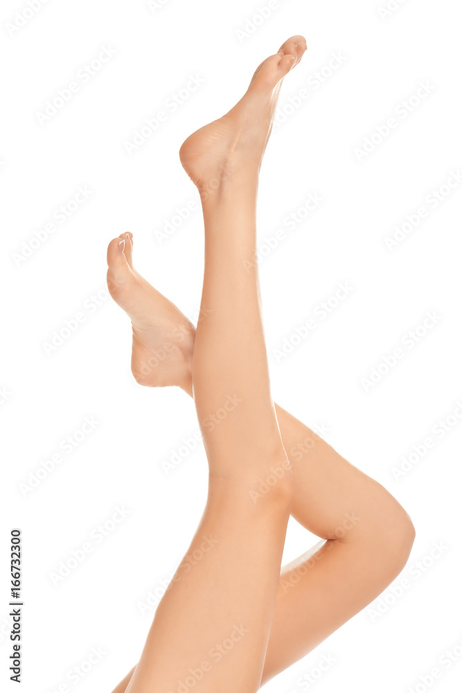 Epilation concept. Legs of beautiful young woman on white background Epilation concept. Legs of beautiful young woman on white background