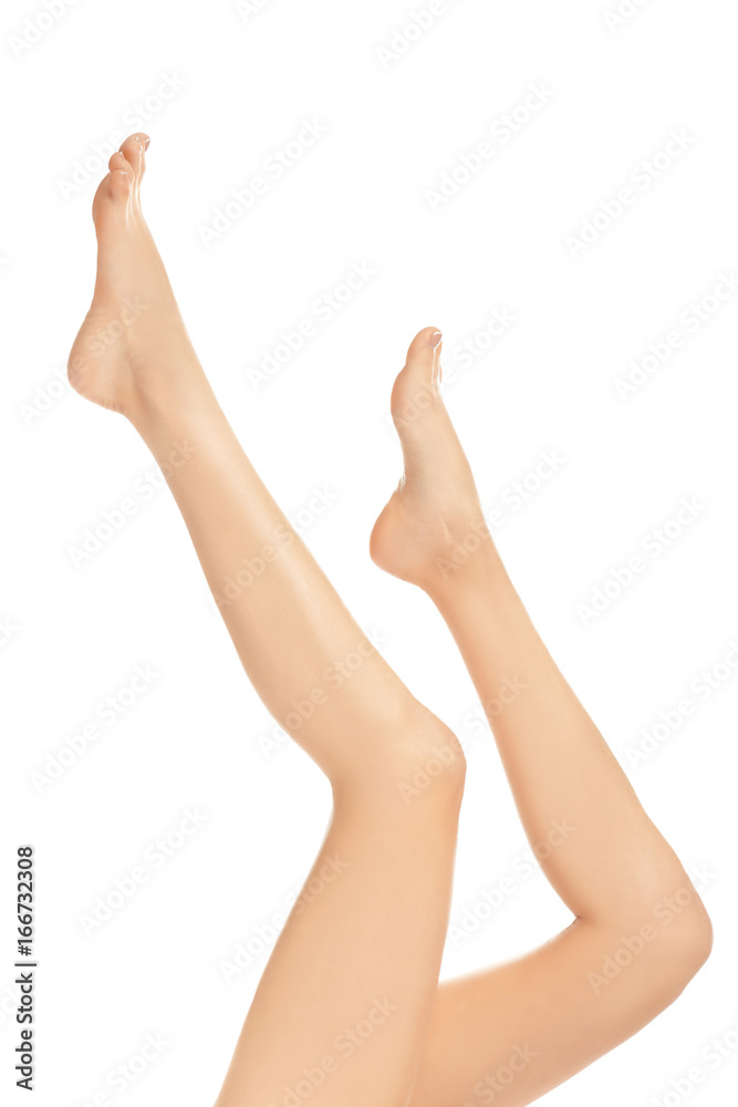 Epilation concept. Legs of beautiful young woman on white background Epilation concept. Legs of beautiful young woman on white background