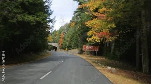 Driving on Acadia National Park's Park Loop Road (aka Acadia All American Road), in Acadia National Park in Autumn.