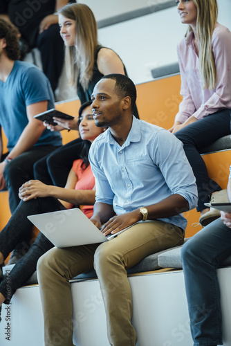 Group of people enjoying a lecture in a modern auditorium