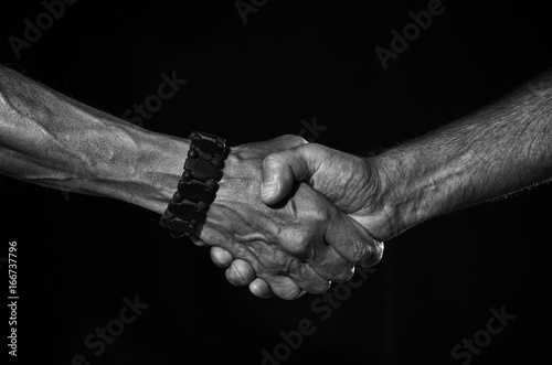Strong masculine handshake.