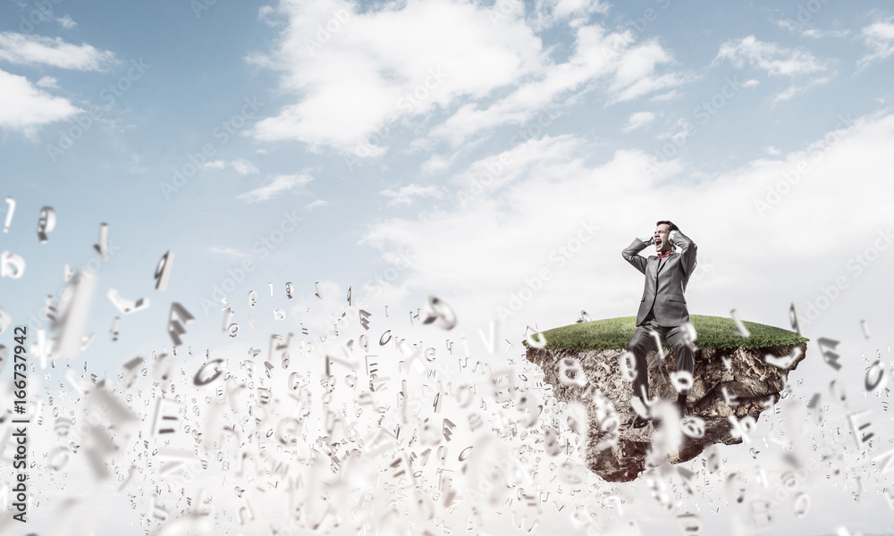 Obraz premium Young man floating in sky and dont want to hear anything