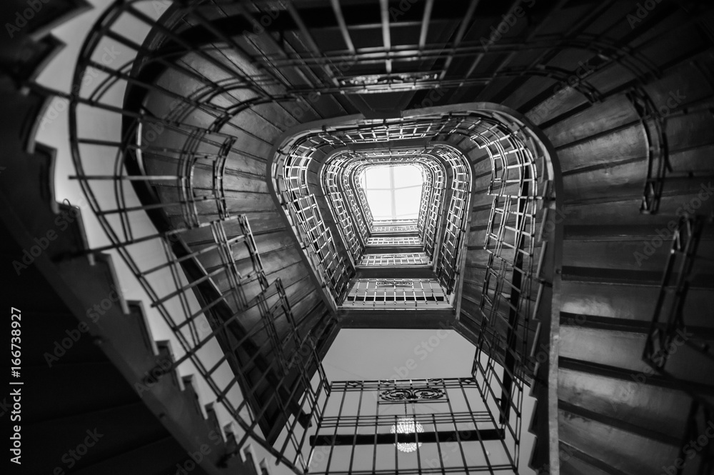 Obraz premium Spiral stairs in the old house.