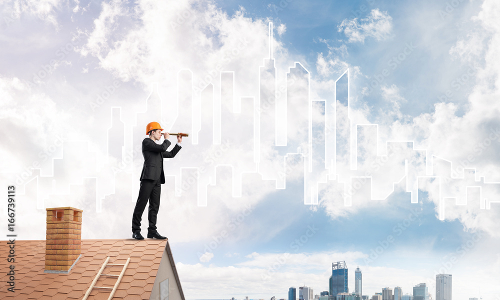 Engineer man standing on roof and looking in spyglass. Mixed media Engineer man standing on roof and looking in spyglass. Mixed media