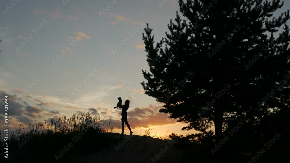mother throws up baby in the sunset mother throws up baby in the sunset