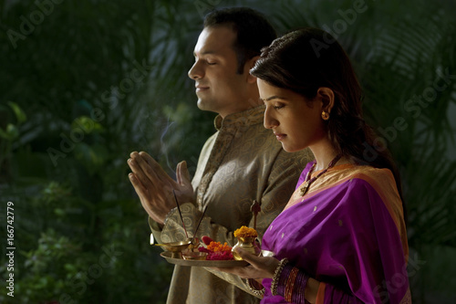 Couple praying during diwali  photo