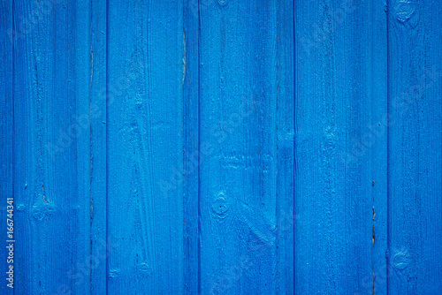 Blue wall of wooden planks,...