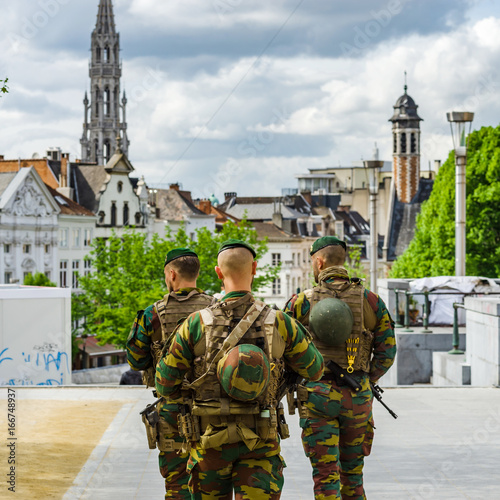 Schilderij op canvas Military patrol on the street of Brussels, summer day