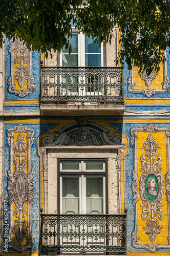 Facade of a house decorated with tiles in Lisbon, capital of Portugal