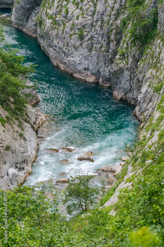 The purest waters of the turquoise color of the river Moraca flowing among the canyons. Montenegro.