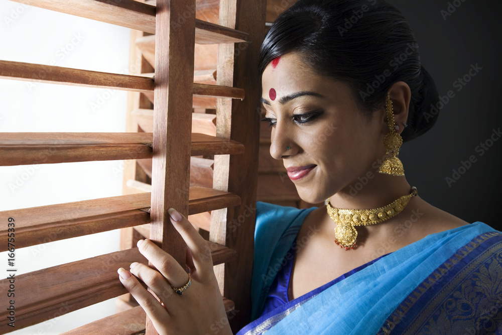 Bengali woman peeking out of a window Stock Photo Adobe Stock