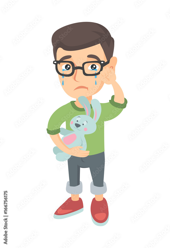 Caucasian boy in glasses crying and wiping the tears away. Little boy crying and holding toy rabbit in hand. Vector sketch cartoon illustration isolated on white background.
