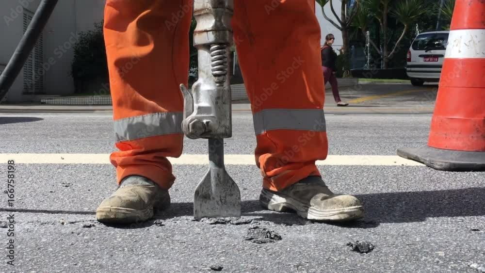 Building demolition jack hammer drill breaking concrete
