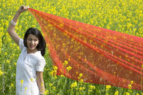 Woman with a chunni in a field  photo