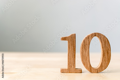 Wood sign number ten on table with copy space