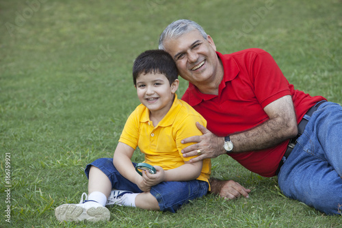 Wallpaper Mural Portrait of young boy with grandfather in a park Torontodigital.ca
