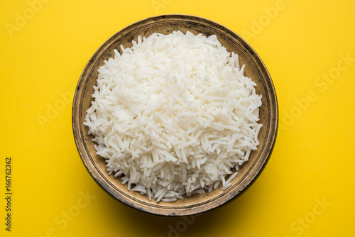 basmati rice in a ceramic bowl, indian white and long basmati rice cooked and served in bowl, selective focus photo