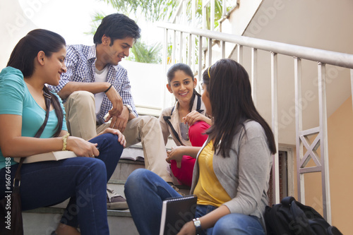 College students sitting on a staircase