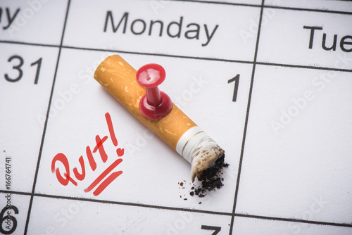 Cigarette on calendar. Time to quit smoking concept