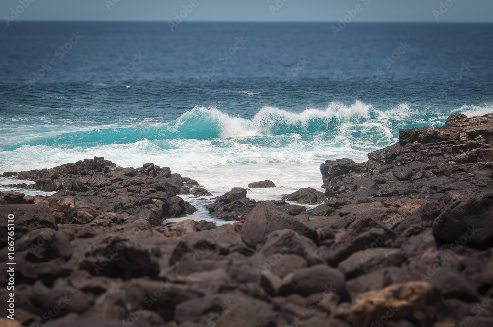 Tilt shift effect of oceanic waves against the Boca de Abaco volcanic rocks coast, Lanzarote, Canary Island