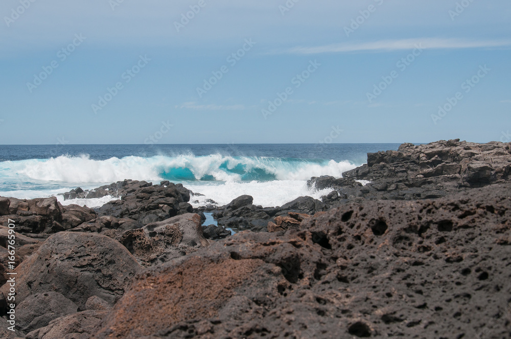 Oceanic waves against the Boca de Abaco volcanic lava rocks coast, Lanzarote, Canary Island