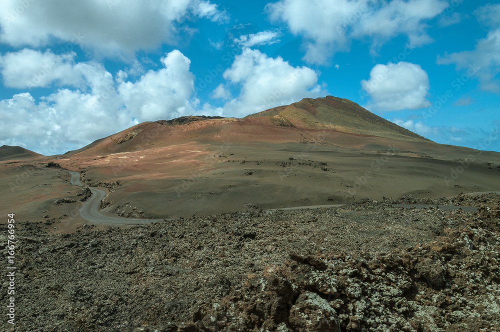 Road at the foot of ancient volcano, Lanzarote, Canary Island