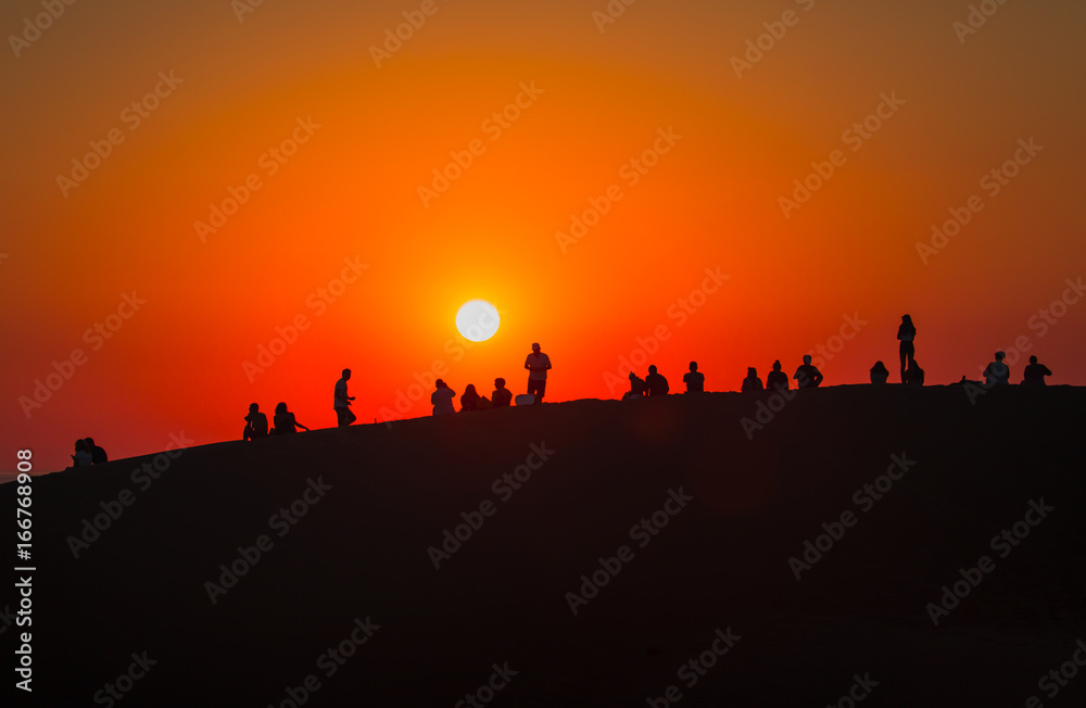People watching sunset on the sand hills - Patara, Antalya