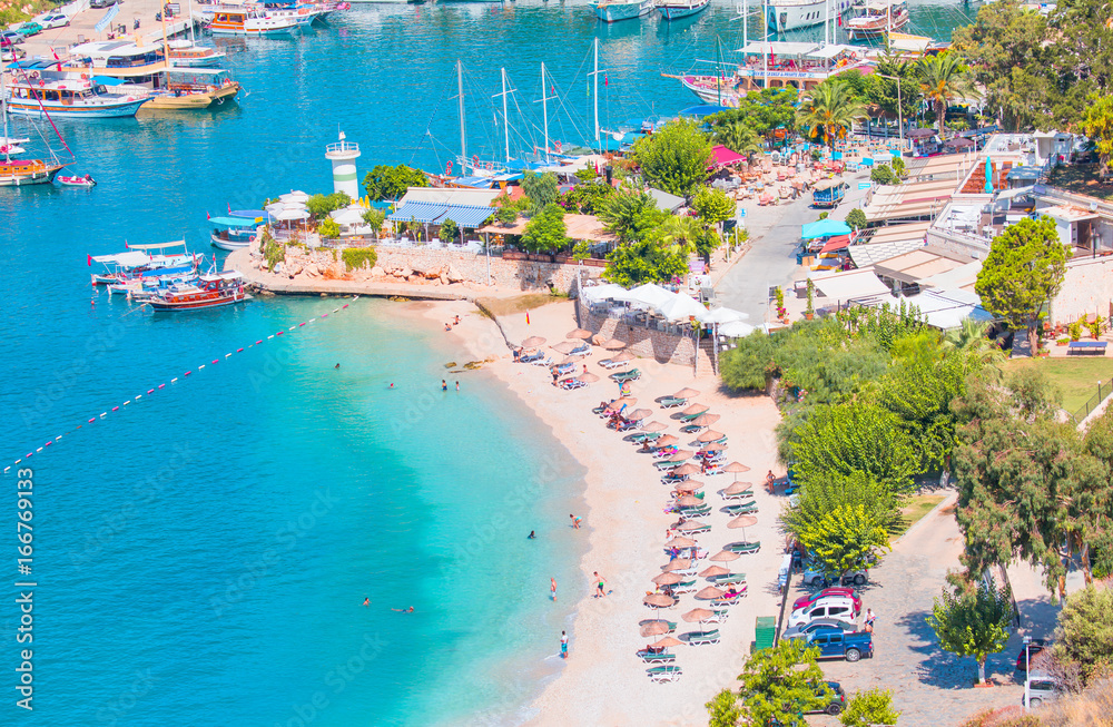 Fototapeta premium Holidaymakers sunbathing at Kalkan beach,