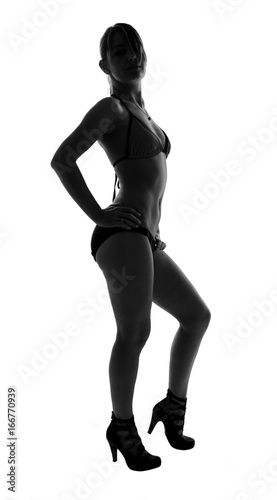 stylish silhouette of caucasian woman posing