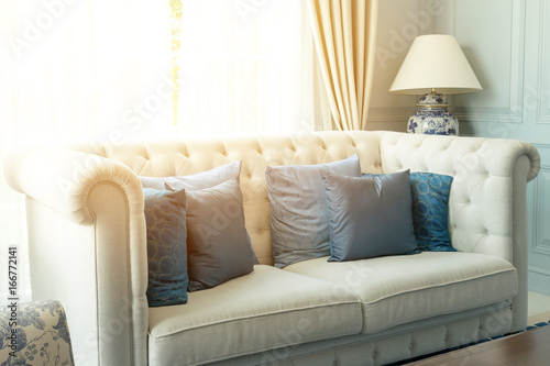 luxury living room interior with blue pattern pillows on sofa