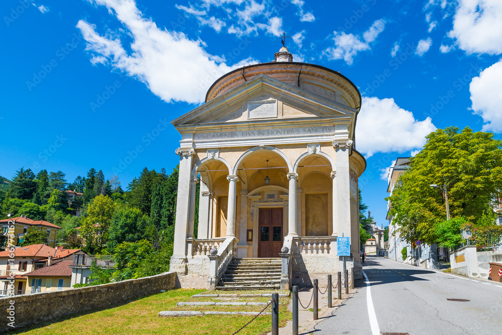 Sacro Monte of Varese (Santa Maria del Monte), Italy, starting point for the Via Sacra with 14 chapels that leads to medieval village. In the foreground the Immaculate church on a beautiful summer day