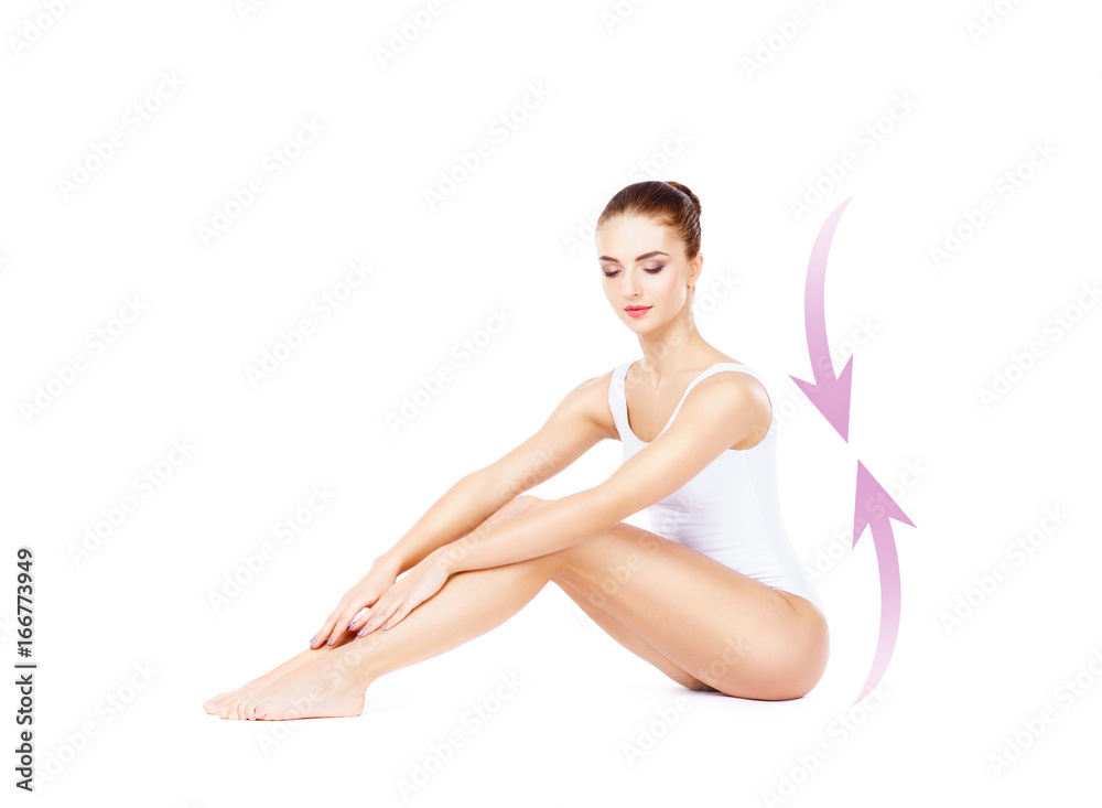 Obraz premium Beautiful fit girl posing on isolated background with drawing arrows. Health, sport, fitness, nutrition, epilation, cellulite and hair removal, liposuction, healthy life-style concept.