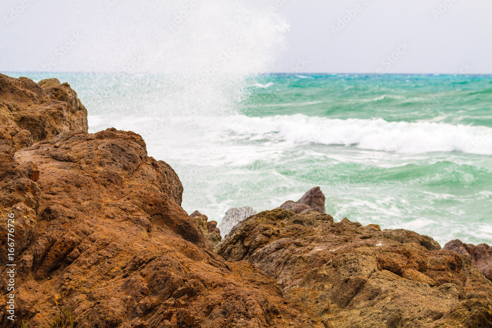 Big wave crashed about rocky seashore, and made spray splash. Big wave crashed about rocky seashore, and made spray splash.