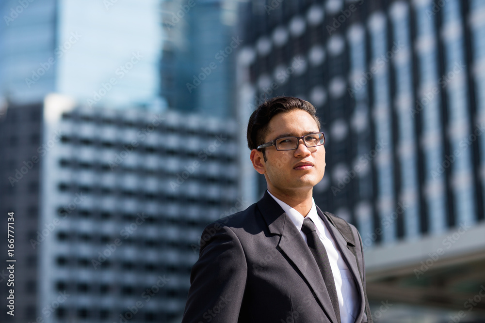 Young asian businessman outdoors Young asian businessman outdoors