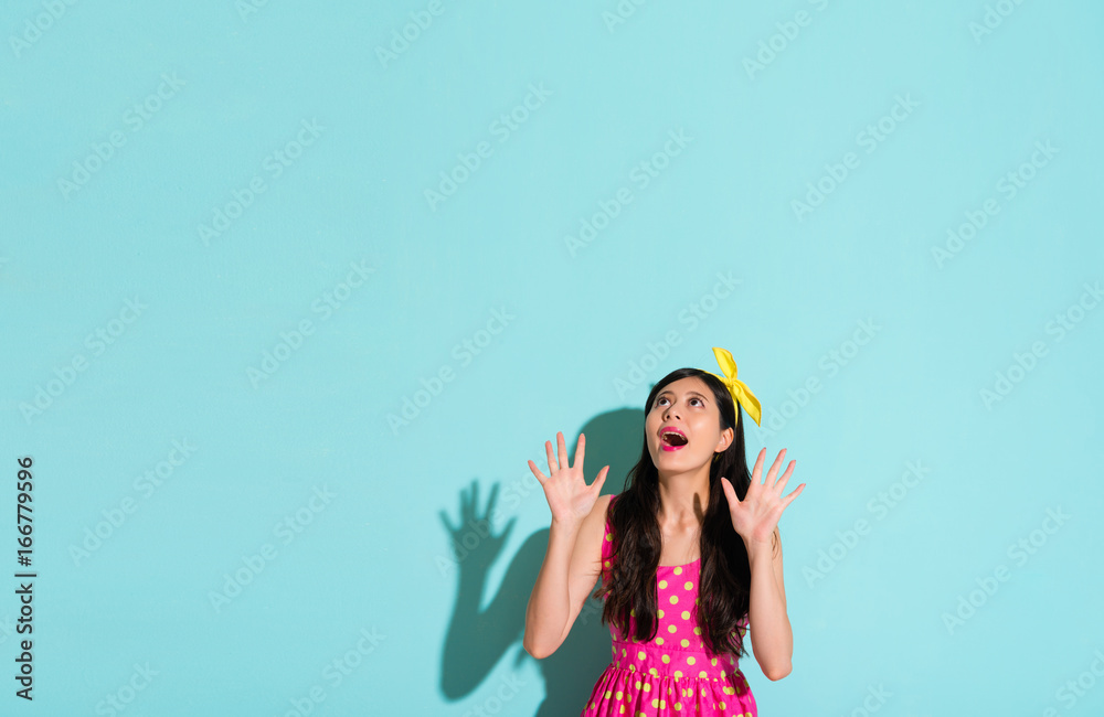 woman shocked looking up on the blank copyspace woman shocked looking up on the blank copyspace