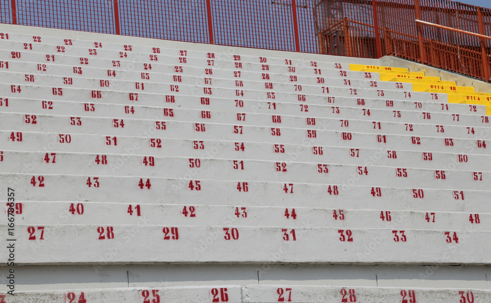 Fototapeta premium many numbers on the stadium bleachers to indicate a seat at even