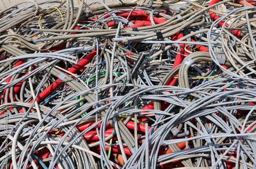 Background of used electrical cables in a dump