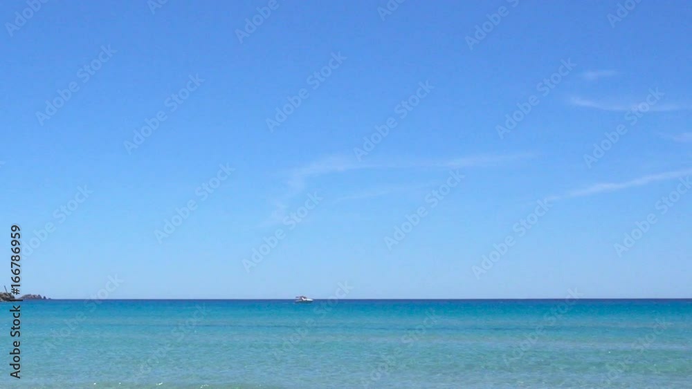 White Wild Mediterranean Sea Beach in Italy with Clear Blue Water White Wild Mediterranean Sea Beach in Italy with Clear Blue Water