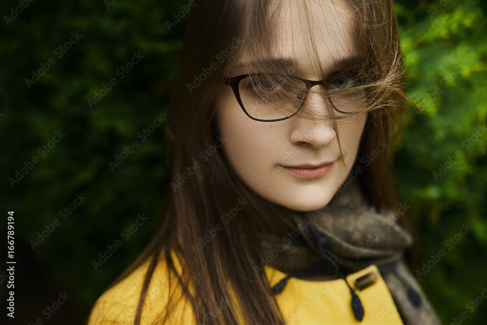 Portrait of a beautiful girl in glasses