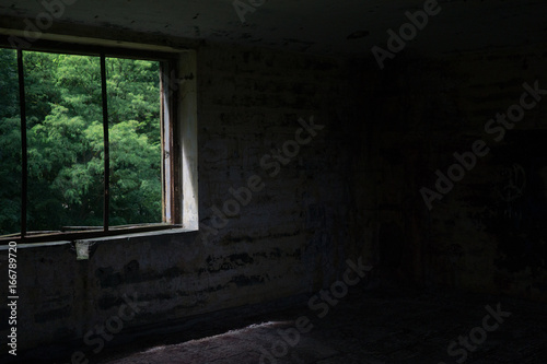 old broken window in the neglected interior