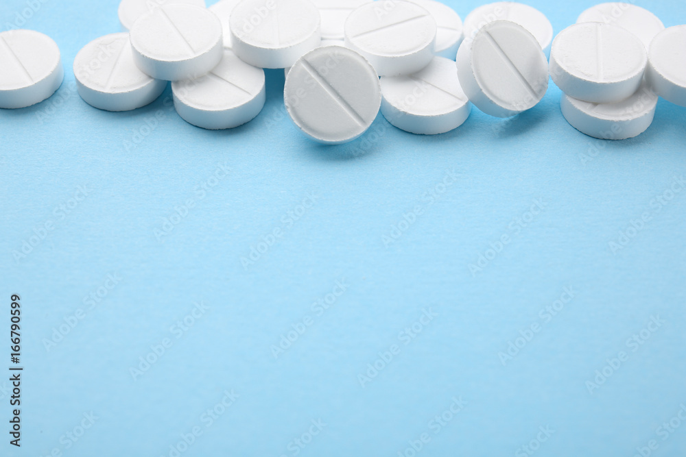Health care concept. Pills on blue background Health care concept. Pills on blue background