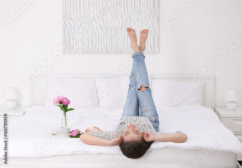 Beautiful young woman lying...