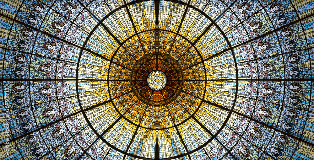 Palau de la Musica Catalana skylight of stained glass designed by Antoni Rigalt i Blanch whose centerpiece is an inverted dome in shades of gold, Barcelona, Spain. - obrazy, fototapety, plakaty 