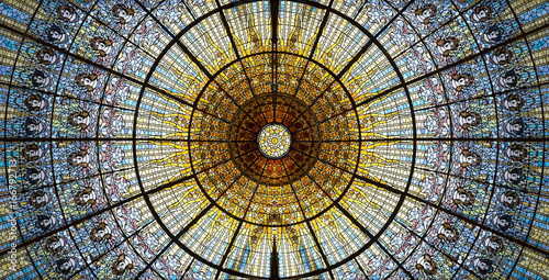 Palau de la Musica Catalana skylight of stained glass designed by Antoni Rigalt i Blanch whose centerpiece is an inverted dome in shades of gold, Barcelona, Spain.