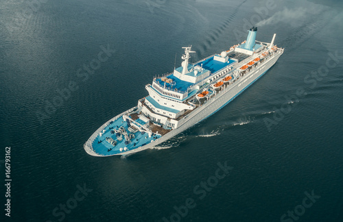Aerial view of passenger ship floating in the open sea